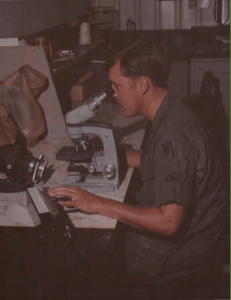 SP4 Francis Heyniger, lab technician, performing a WBC differential on a war dog at the 9th Med Lab, Long Binh, Vietnam. Photo Credit: Army Medicine